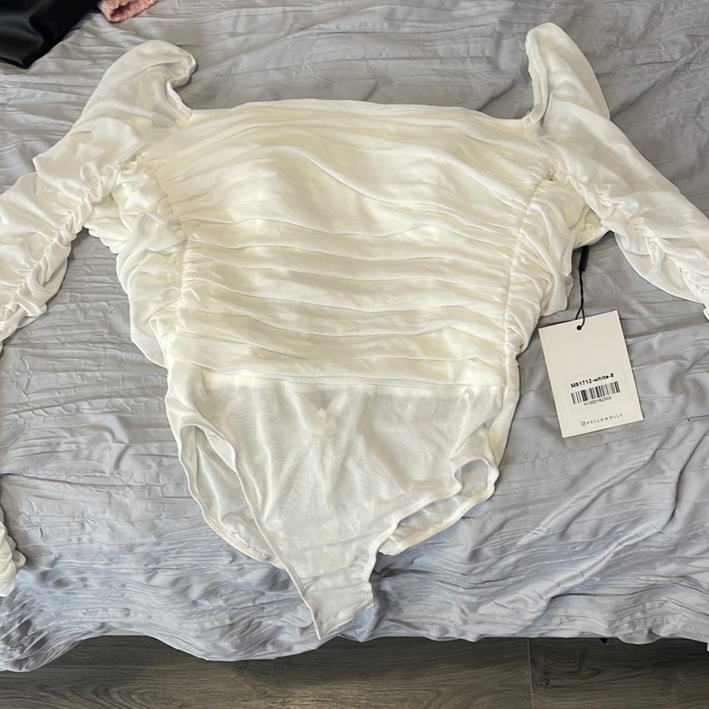 White, mesh body suit. Never worn and new with tags. Hello Molly, built in bra.
